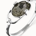 Bangle bracelet with oval faceted gray crystal